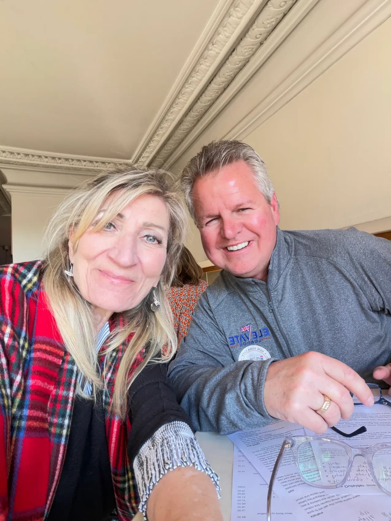 Carol and David smiling together indoors