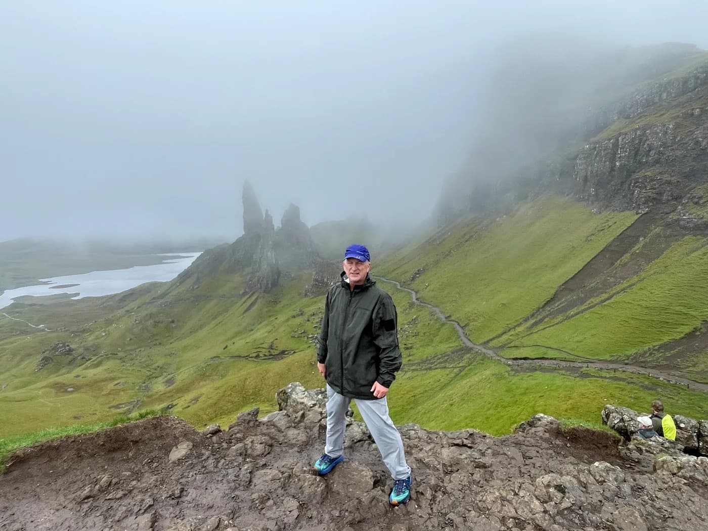 Ed on a hillside beneath the Old Man of Storr on Skye