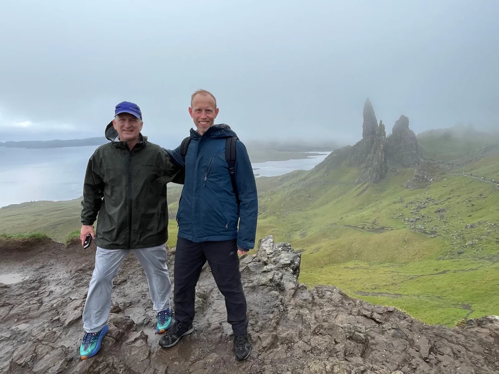 Ed and a companion at a misty Highland viewpoint