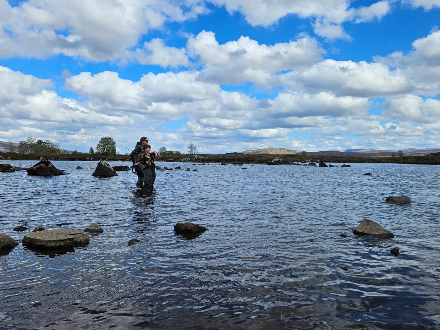 A member of the McCormick family fly-fishing in open water