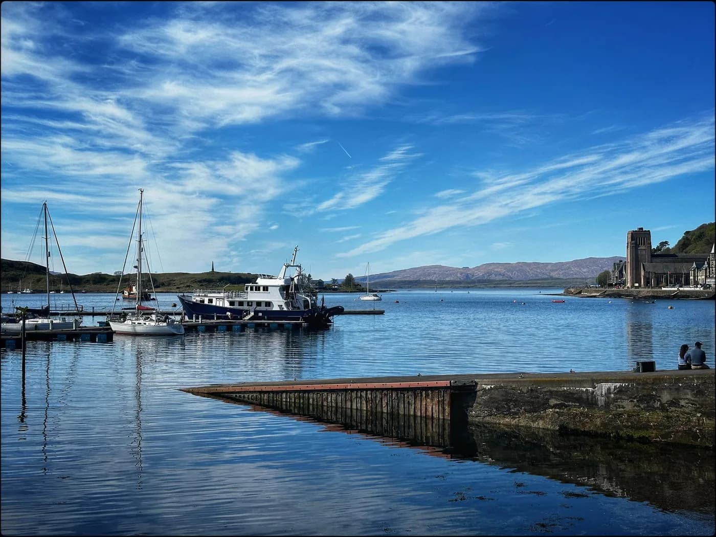 Sailing boats on the calm water at Oban