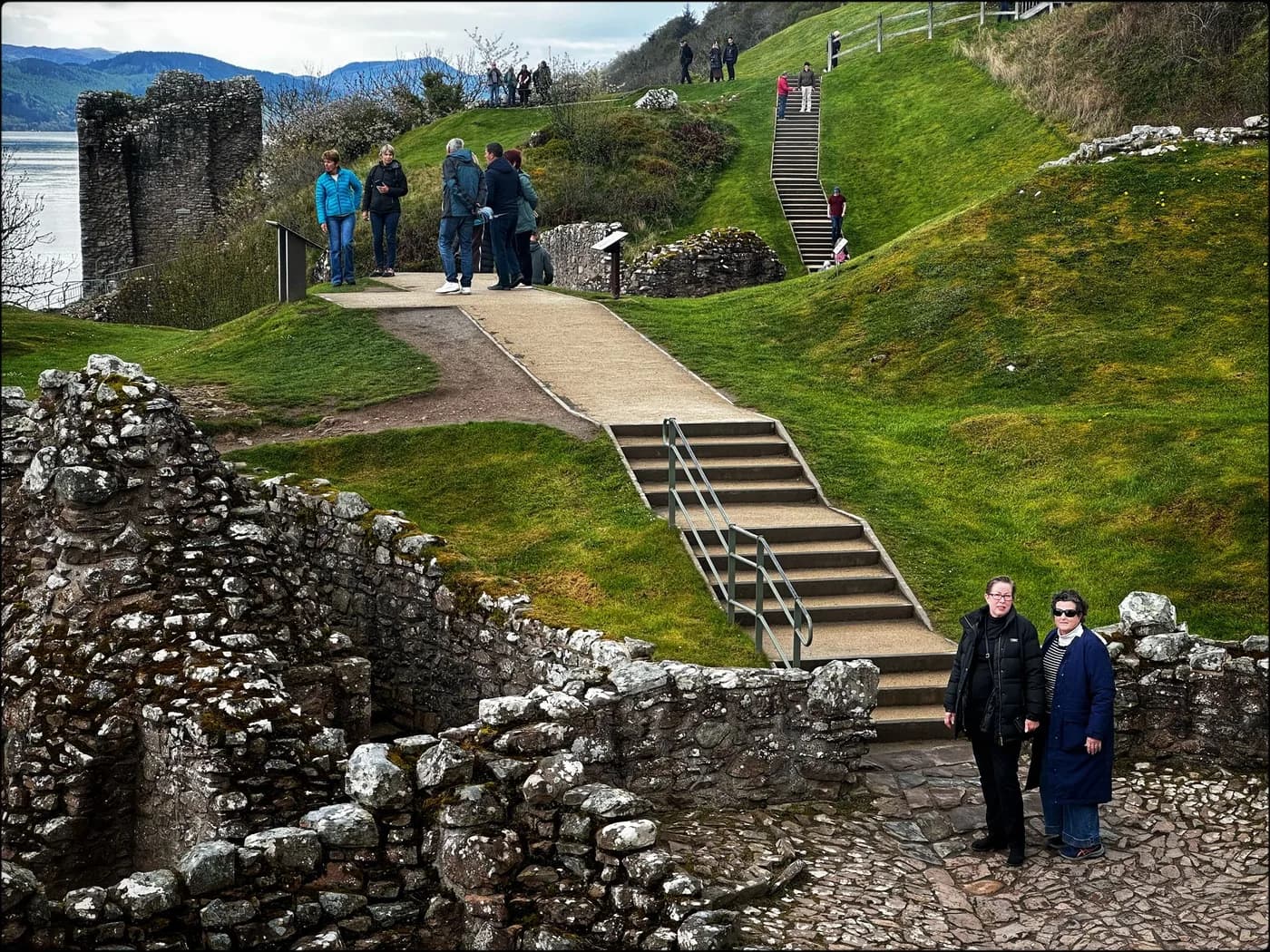 Rebecca and her sister beside the ruins of Urquhart Castle