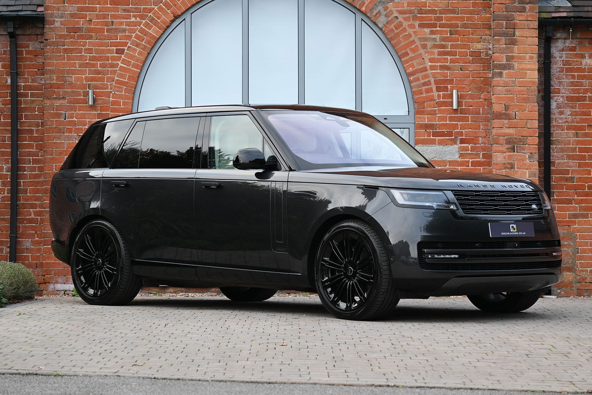 Dark Range Rover LWB, viewed from the front and side